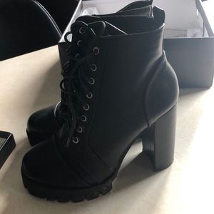 Healed black combat boots